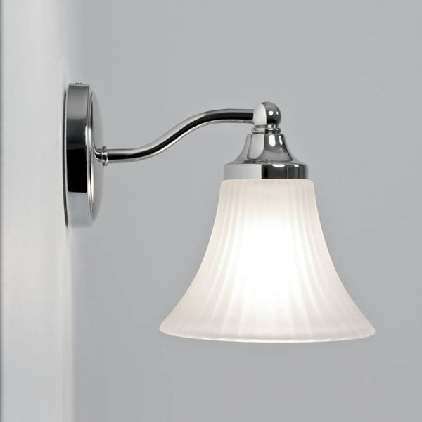 Hotel wall sconce wiith glass shade